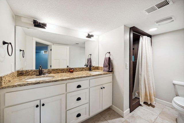 2650 Fox St, Orono, MN 55391 - full bath with toilet, double vanity, baseboards, curtained shower, and a textured ceiling