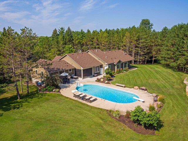 2650 Fox St, Orono, MN 55391 - swimming pool with a diving board, a patio, a lawn, and a view of trees