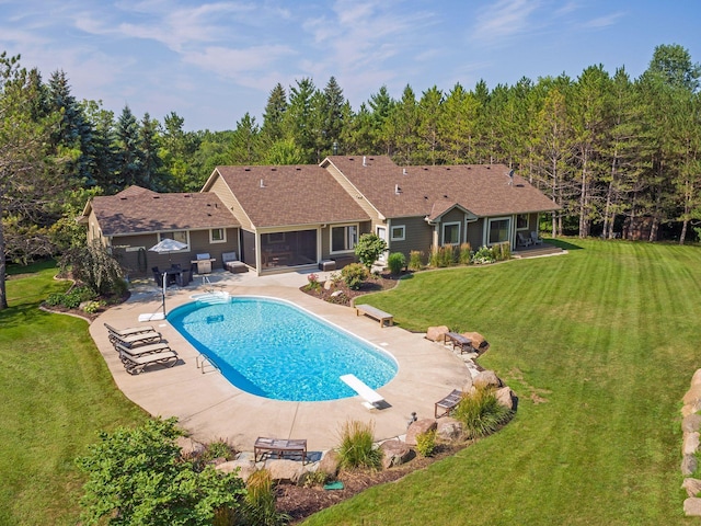 2650 Fox St, Orono, MN 55391 - swimming pool featuring a diving board, a patio, a lawn, and a sunroom