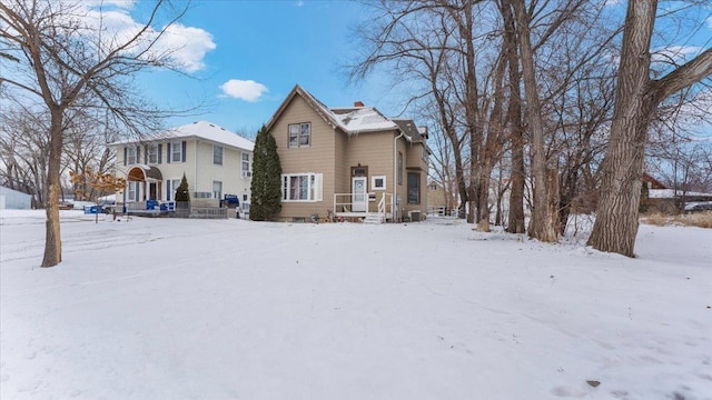 view of snow covered house