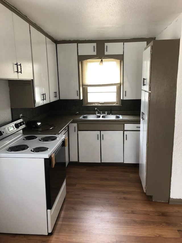 kitchen featuring sink, white cabinetry, range with electric cooktop, dark hardwood / wood-style floors, and a textured ceiling