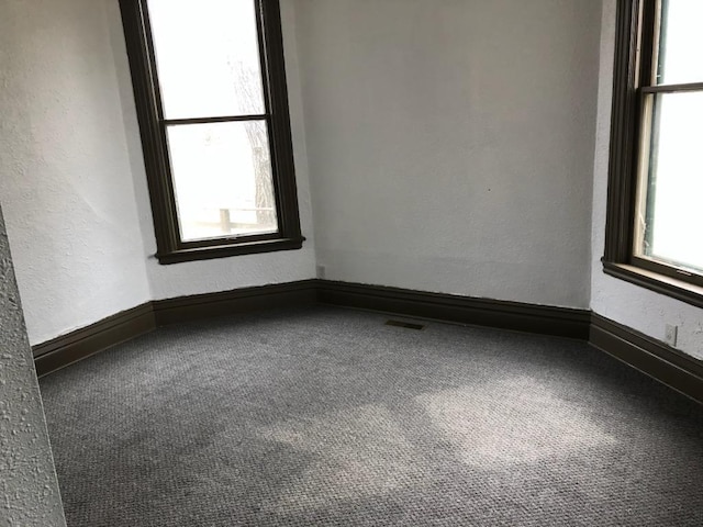 empty room featuring carpet flooring