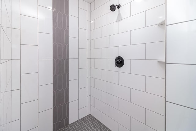 bathroom with a tile shower