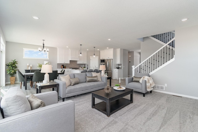 living room featuring an inviting chandelier