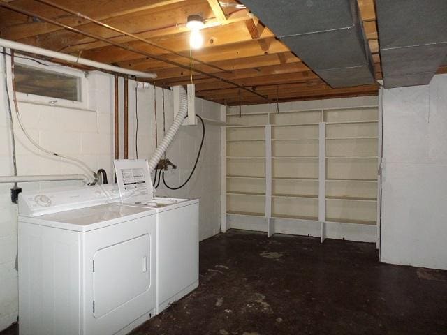 clothes washing area featuring washer and dryer