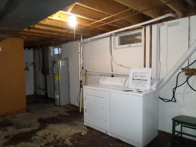 laundry area featuring washer and dryer and water heater