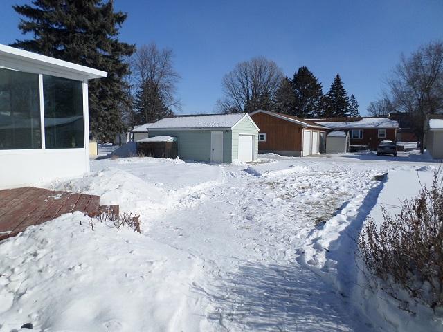 exterior space featuring a storage unit