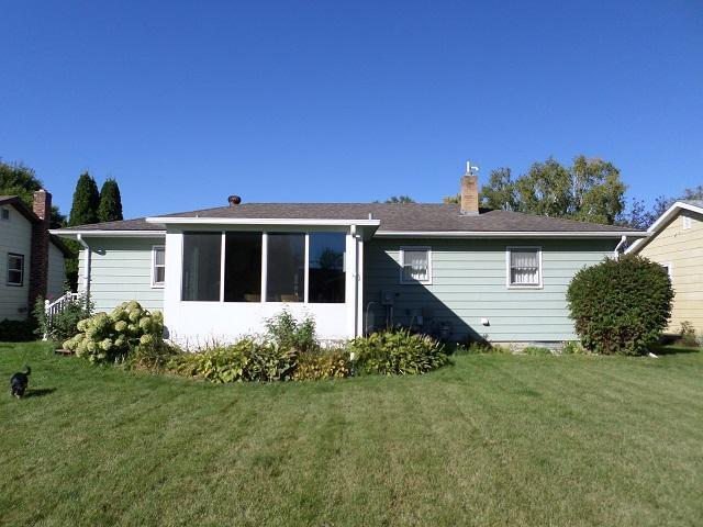 rear view of house with a yard