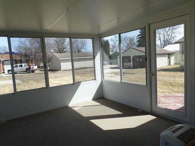 unfurnished sunroom featuring a wealth of natural light