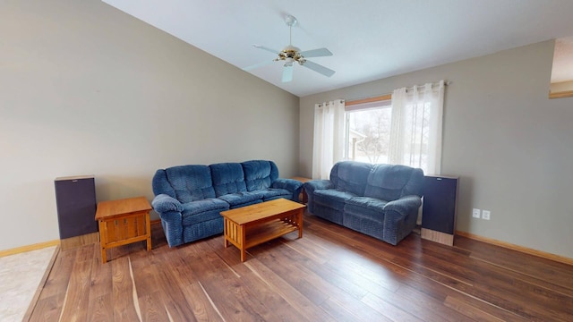 living room featuring ceiling fan, dark hardwood / wood-style flooring, and vaulted ceiling