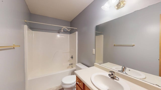 full bathroom with vanity, bathtub / shower combination, and toilet