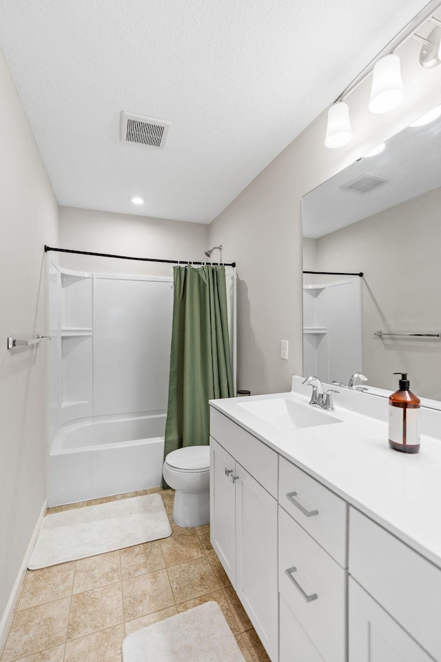 full bathroom featuring tile patterned flooring, shower / bath combo, vanity, and toilet