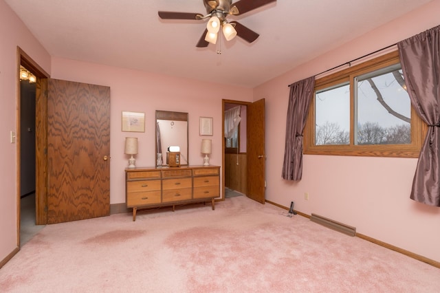 unfurnished bedroom featuring ceiling fan and light colored carpet