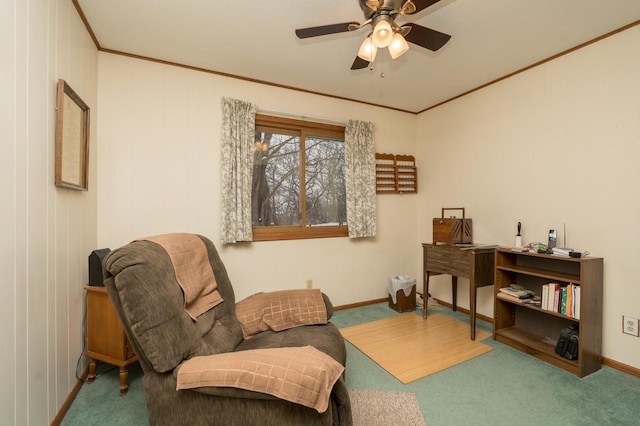 sitting room featuring crown molding, ceiling fan, and carpet floors