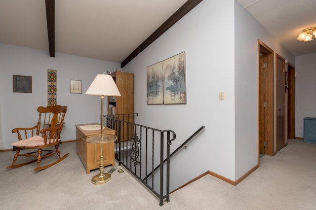 stairs with lofted ceiling with beams and carpet floors