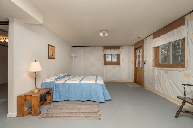 bedroom with concrete flooring