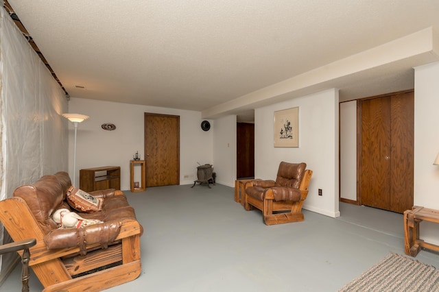 living room with concrete flooring and a textured ceiling