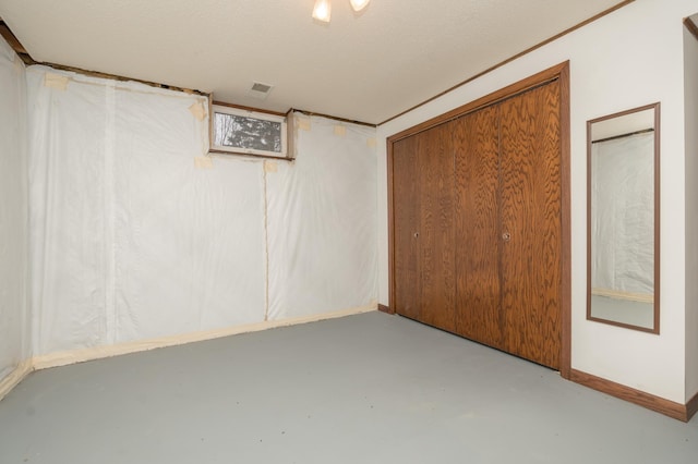 basement with a textured ceiling