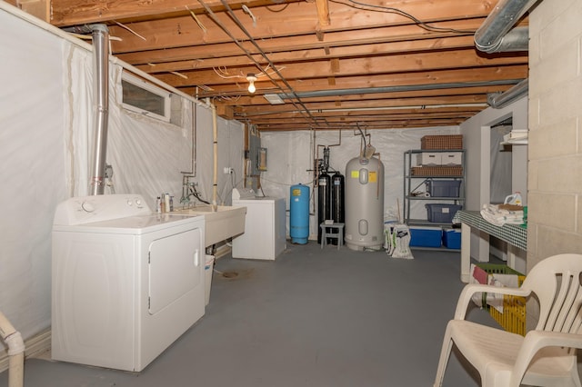 basement featuring separate washer and dryer and sink