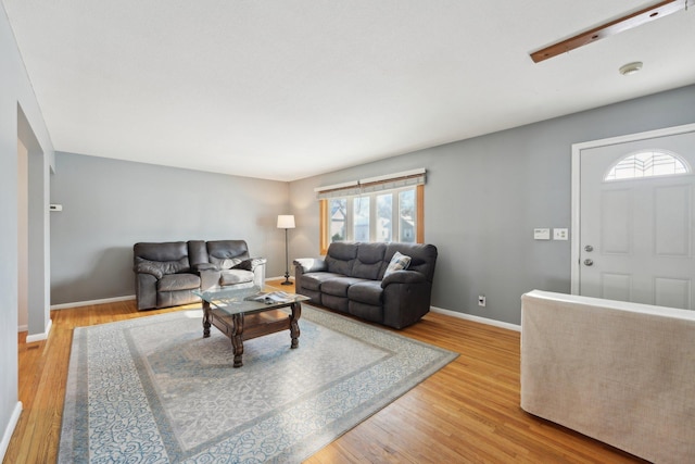 living room with wood finished floors and baseboards