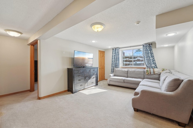 living area featuring recessed lighting, carpet flooring, a textured ceiling, and baseboards