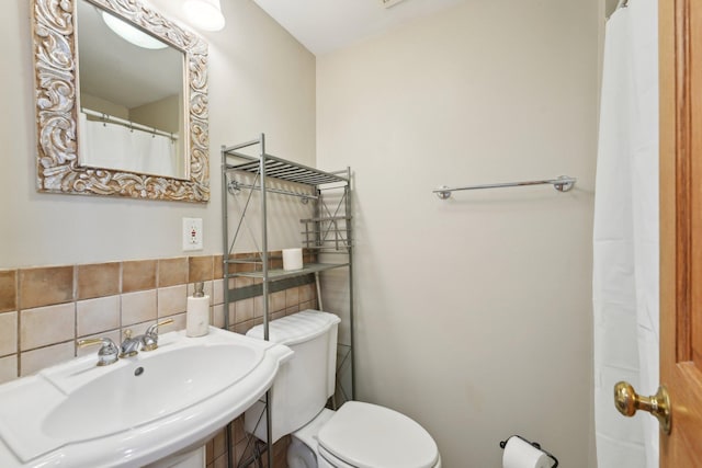 bathroom featuring toilet and a sink