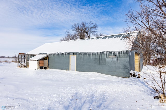 view of snow covered garage