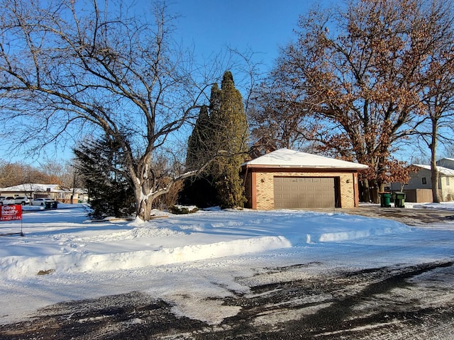 exterior space with an outbuilding and brick siding