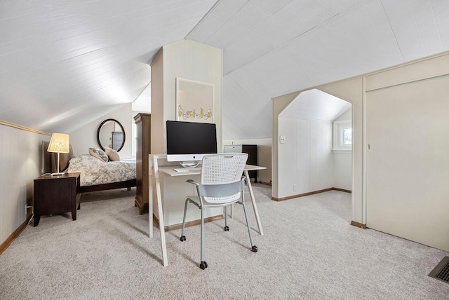 office featuring lofted ceiling and light carpet