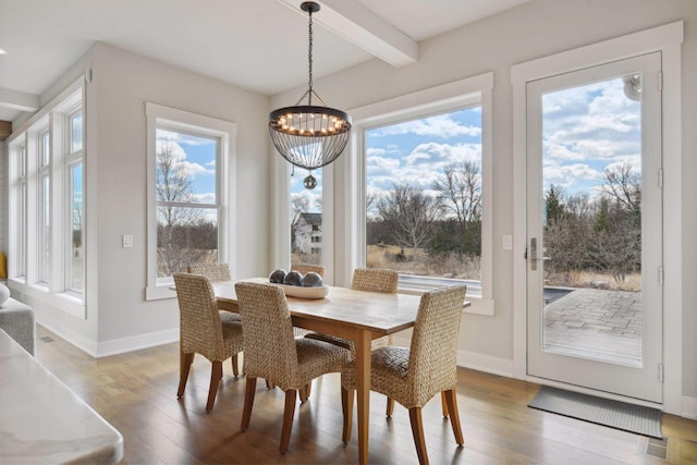4765 Augusta St, Orono, MN 55364 - dining room with a chandelier, beam ceiling, and wood finished floors