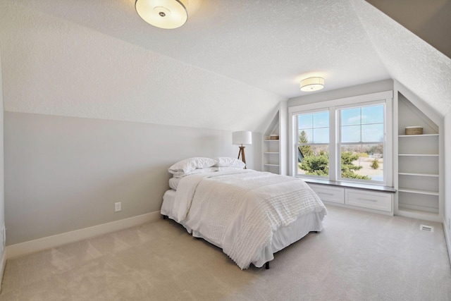 4765 Augusta St, Orono, MN 55364 - bedroom featuring a textured ceiling, vaulted ceiling, and light carpet