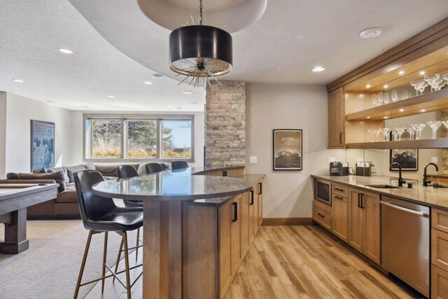 4765 Augusta St, Orono, MN 55364 - kitchen with appliances with stainless steel finishes, a kitchen breakfast bar, dark stone counters, open shelves, and a peninsula