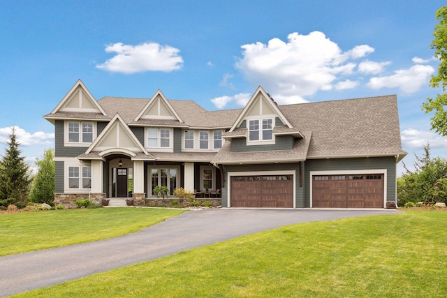 4765 Augusta St, Orono, MN 55364 - view of front of property featuring driveway, a front lawn, a shingled roof, and stone siding