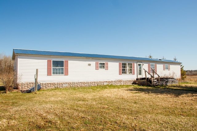 4906 32nd St SW, Pine River, MN 56474 - view of front of home with metal roof and a front lawn