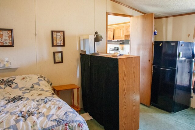 4906 32nd St SW, Pine River, MN 56474 - bedroom featuring crown molding, light colored carpet, a textured ceiling, freestanding refrigerator, and vaulted ceiling