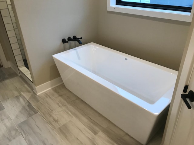 bathroom featuring a bath