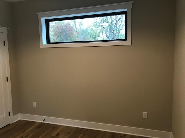 empty room featuring dark hardwood / wood-style floors