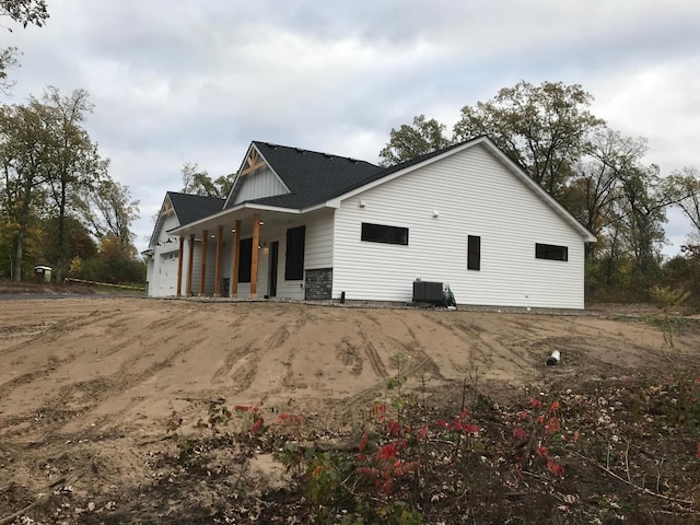 view of home's exterior featuring a garage and central AC