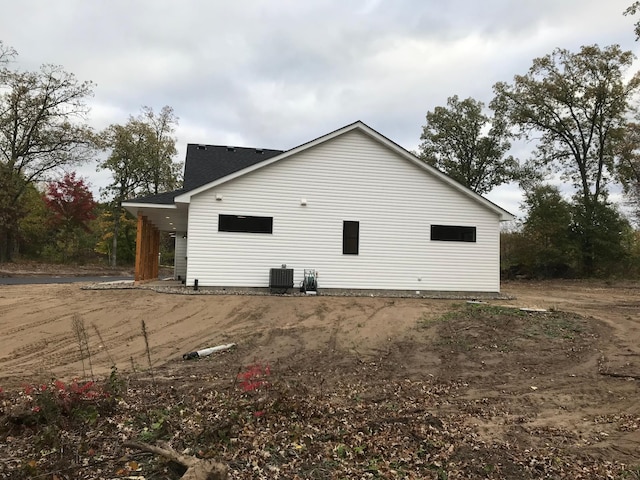 view of property exterior with central AC unit