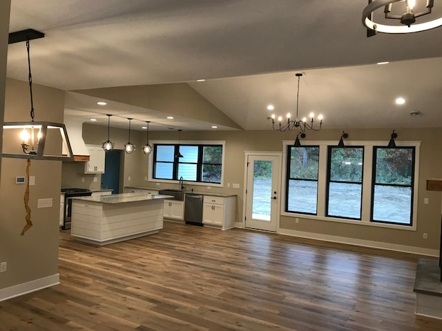 kitchen featuring pendant lighting, a notable chandelier, appliances with stainless steel finishes, and white cabinets