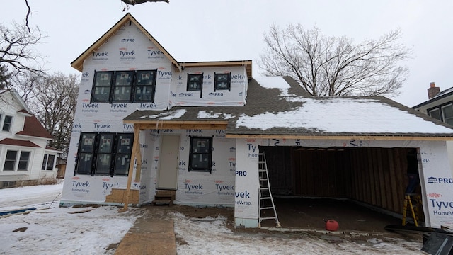 unfinished property featuring a garage