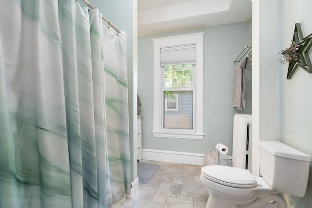 full bathroom featuring radiator, baseboards, and toilet