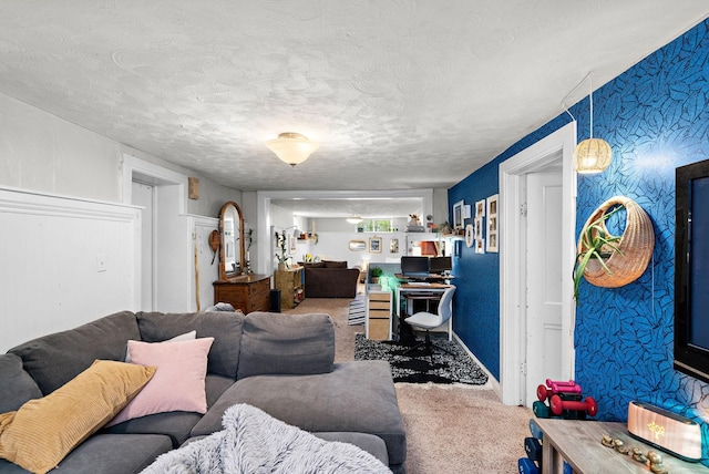 living area featuring carpet floors and a textured ceiling