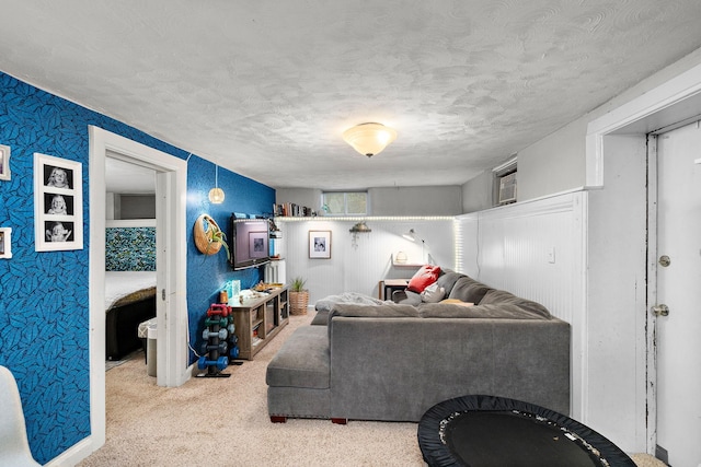 living room with carpet flooring and a textured ceiling