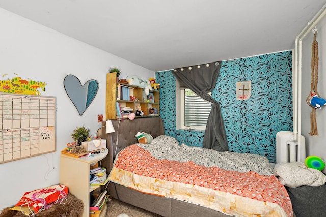 carpeted bedroom with radiator