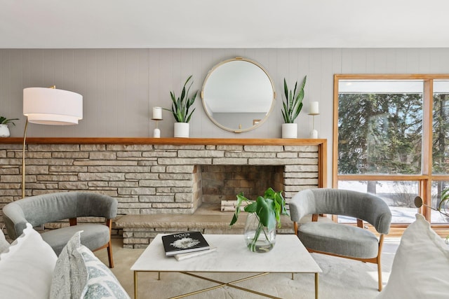 living room with a brick fireplace and a healthy amount of sunlight