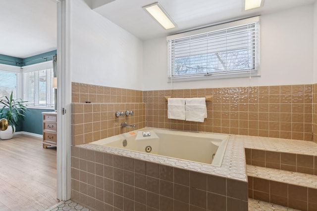 bathroom with tiled tub