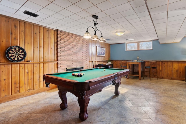 playroom featuring pool table and wood walls