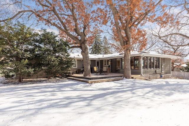 view of front facade with a sunroom