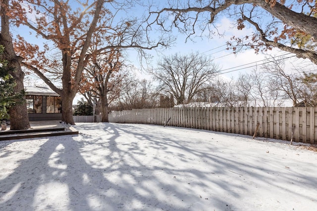 view of yard layered in snow